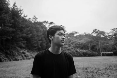 Portrait of young man looking away