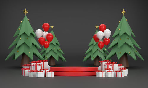 Close-up of christmas decorations over black background