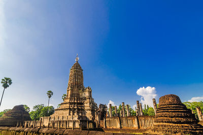 Low angle view of temple building against blue sky