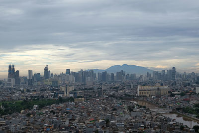 Aerial view of city buildings against sky