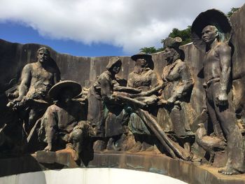 Low angle view of statue against sky