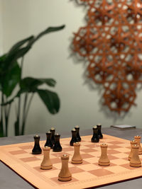 Close-up of chess pieces on table