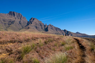 Scenic view of mountains against clear blue sky