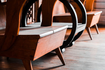 Empty wooden chairs in store