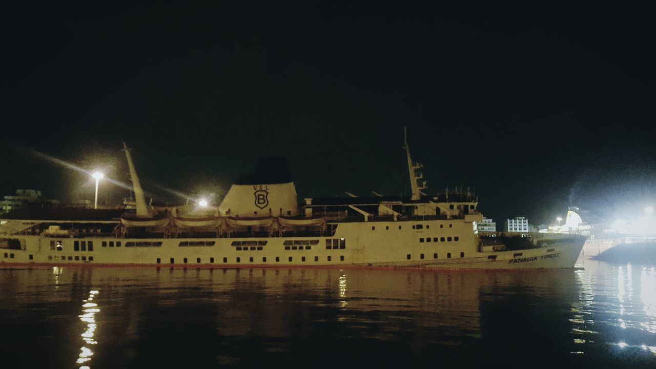 night, water, illuminated, waterfront, reflection, building exterior, built structure, architecture, transportation, clear sky, street light, river, copy space, mode of transport, nautical vessel, sky, sea, outdoors, city, lighting equipment