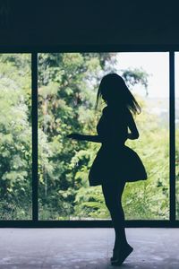 Silhouette of woman dancing