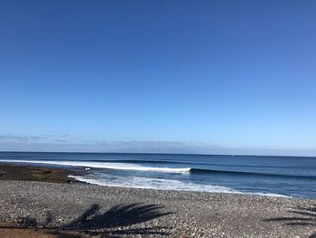 View of beach against clear sky