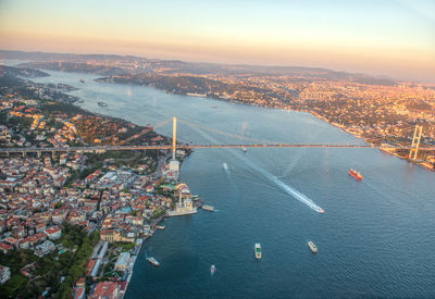 High angle view of suspension bridge over river against sky