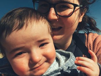 Close-up portrait of happy mother with baby