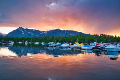 Boats in marina at sunset