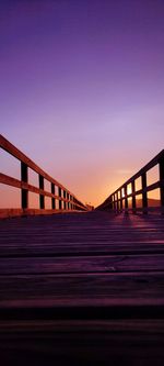 Bridge against clear sky during sunset