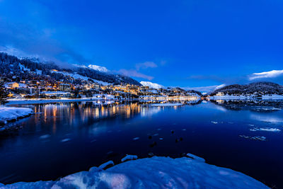 View of beautiful night lights of st. moritz town in switzerland at night in winter