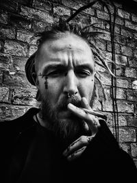 Portrait of man smoking cigarette