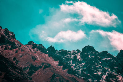 Low angle view of rocks against sky