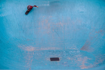 Man swimming in pool