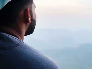 Rear view of man looking at mountain