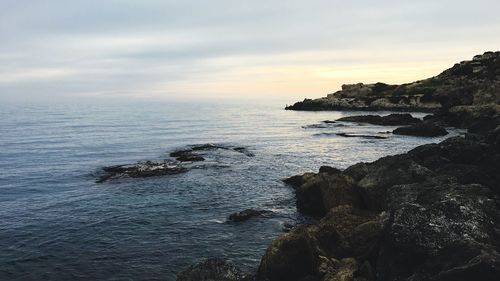 Scenic view of sea against sky during sunset