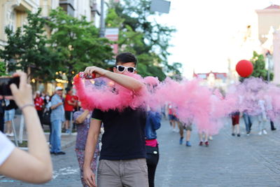 People standing on street in city