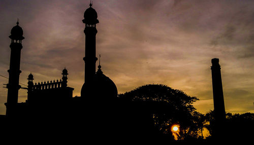 Silhouette of city at sunset