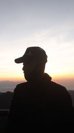 Portrait of silhouette man standing against sky during sunset