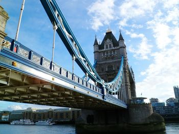 Tower bridge over thames river against sky