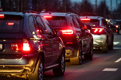 Automobile brake lights at evening time, traffic jam on a highway street in city