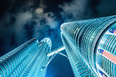 Low angle view of modern building against blue sky