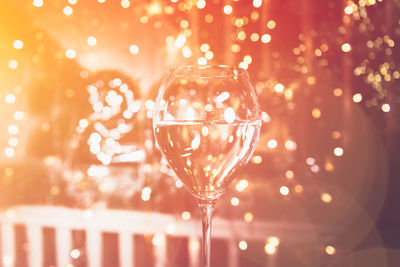 Cheers. glass of champagne for new year 2021 celebration. beautiful christmas lights