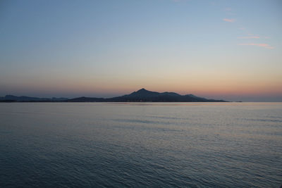 Scenic view of sea against clear sky during sunset