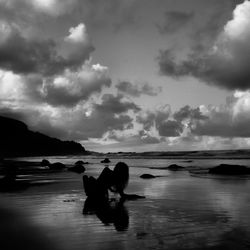 Scenic view of sea against cloudy sky