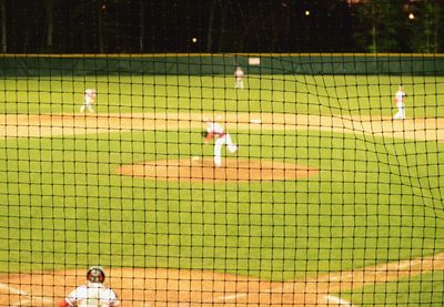 People playing baseball on field