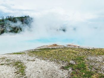 Scenic view of clouds over mountain