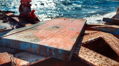 Close-up of wood against sea