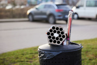 Used fireworks, finished holidays, trash cans filled with trash from the holidays.