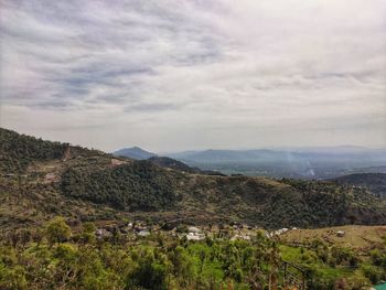 Scenic view of landscape and mountains against sky