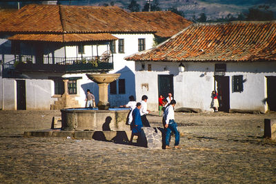 Rear view of woman walking on street