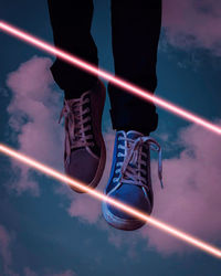 Low section of person against sky