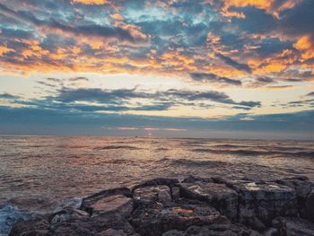 Scenic view of sea against sky during sunset