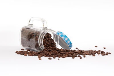 Close-up of coffee beans against white background