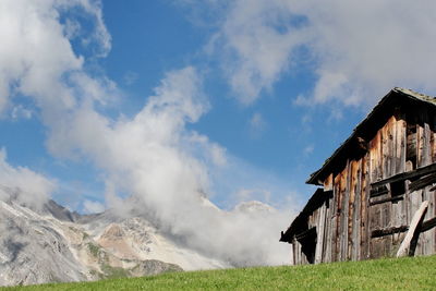 Beautiful view of old house against cloudy sky