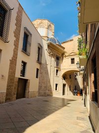 Narrow street amidst buildings in town