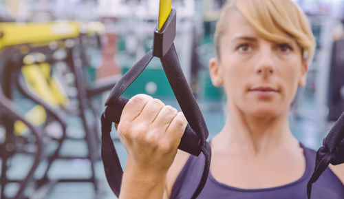 Woman holding resistance band at gym