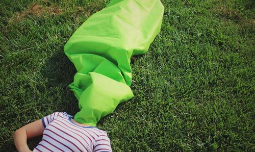 Woman lying on field