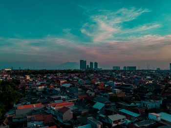 High angle view of townscape against sky at sunset