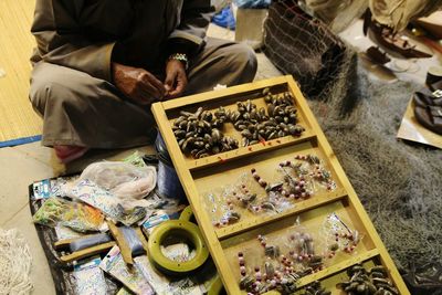 High angle view of man sitting on table