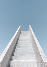 Low angle view of building against clear blue sky