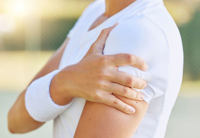 Midsection of doctor holding hands