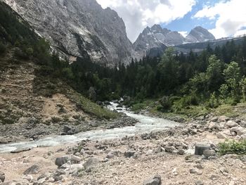 Scenic view of mountains against cloudy sky