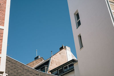 Low angle view of buildings against clear sky