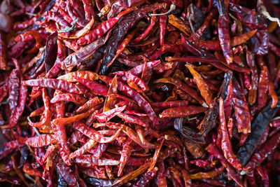 Full frame shot of red chili peppers for sale at market